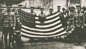 Students at Troy High School display the Roosevelt flag with rows of missing stars