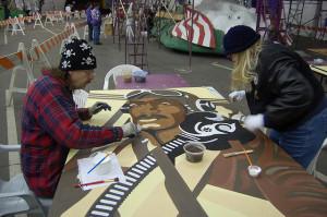 Decorating the parade float with flowers and natural materials.  Photo by stu_spivack