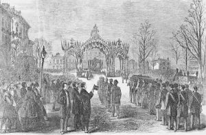 Flags fly atop a memorial arch in Chicago as Lincoln's casket is carried from the train. (Library of Congress)