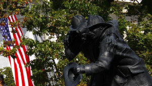 A flag flies at Fallen Firefighters Memorial Wall in Albany, New York. (NYS Department of Homeland Security and Emergency Services)