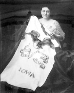 Dixie Gebhardt with Iowa's flag, which she created.