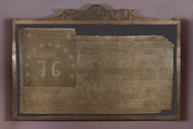 the original bennington flag in a decorative frame